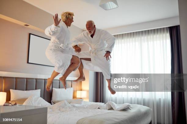 senior couple in a hotel - couple short hair stock pictures, royalty-free photos & images