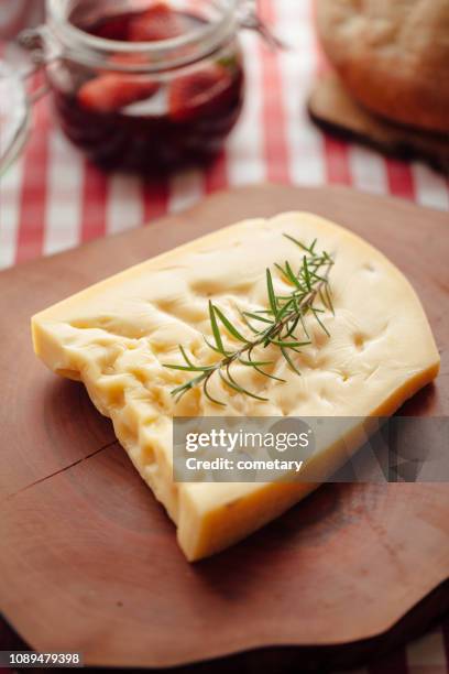 gruyere, swedish cheese on cutting board - gruyere stock pictures, royalty-free photos & images