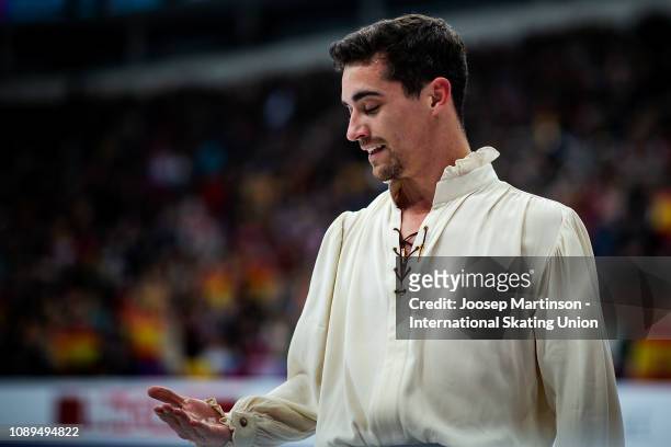 Javier Fernandez of Spain looks at ice in his hand after competing in his last competition in the Men's Free Skating during day four of the ISU...