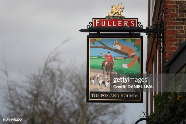 Fuller's logo is pictured on a sign outside a pub next to the Fuller's Griffin Brewery in Chiswick, west London on January 26, 2019. Japanese brewer...