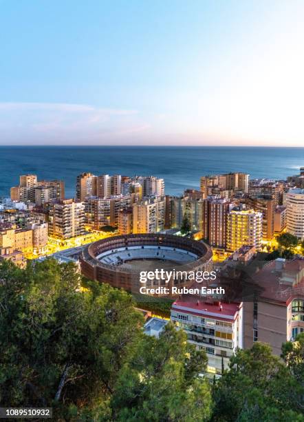 bullring of málaga at dusk - málaga stockfoto's en -beelden