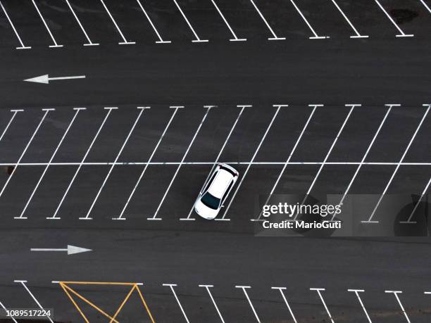 one car at a parking lot - aerial single object stock pictures, royalty-free photos & images