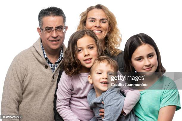 multi ethnic family of five posing together - family formal portrait stock pictures, royalty-free photos & images