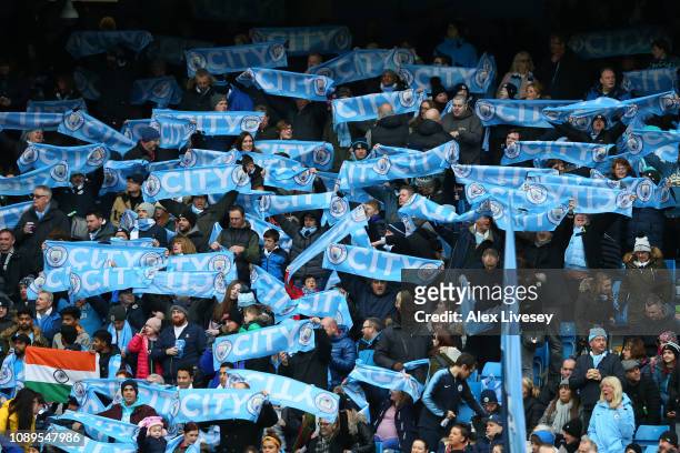 Manchester City fans hold up scarfs prior to the FA Cup Fourth Round match between Manchester City and Burnley at Etihad Stadium on January 26, 2019...