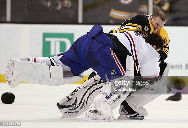 Tim Thomas of the Boston Bruins and Carey Price of the Montreal Canadiens fight in the second period on February 9, 2011 at the TD Garden in Boston,...