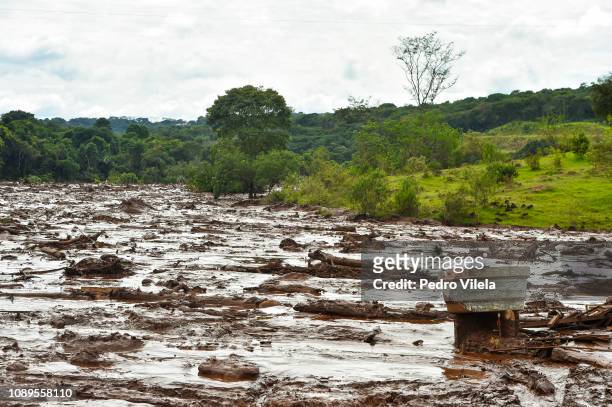 Mudslides affected areas buried in mining waste a day after the collapse of a dam from an iron-ore mine belonging to Brazil's mining company Vale, in...