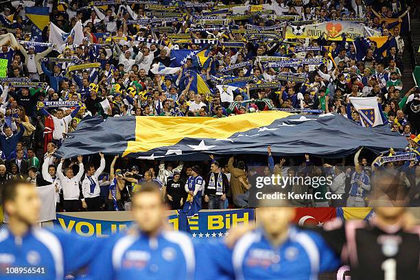 Fans of Bosnia-Herzegovina hold up a large flag during their anthem before facing Mexico during an international friendly match at Georgia Dome on...