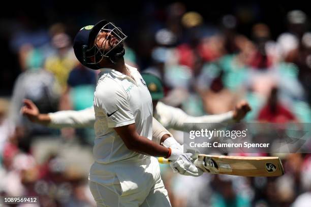 Cheteshwar Pujara of India reacts after being dismissed by Nathan Lyon of Australia during day two of the Fourth Test match in the series between...
