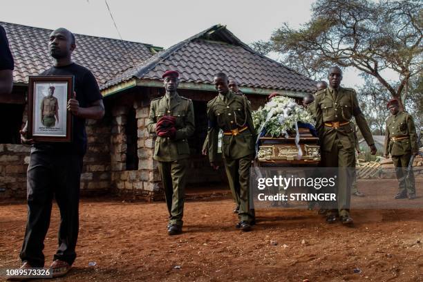 Kenyan police officers of the General Service Unit carry the coffin of Japhet Nuru, the GSU officer who was killed in last week terror attack in...