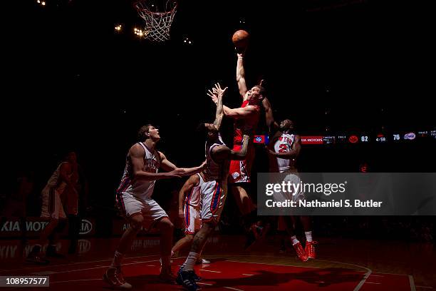 Blake Griffin of the Los Angeles Clippers shoots against Wilson Chandler and Raymond Felon of the New York Knicks during a game on February 9, 2011...