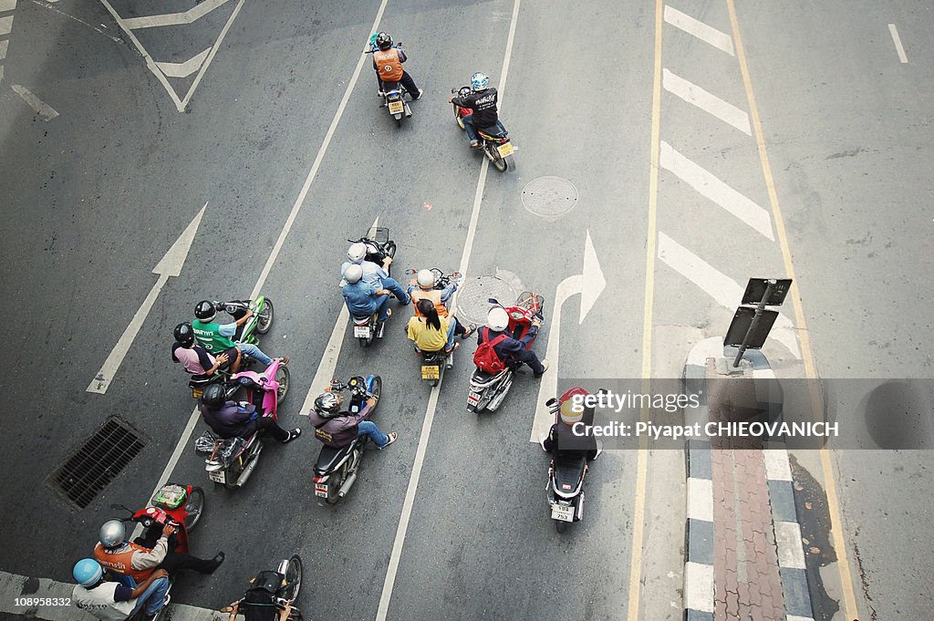 Motocycles are waiting at the junction