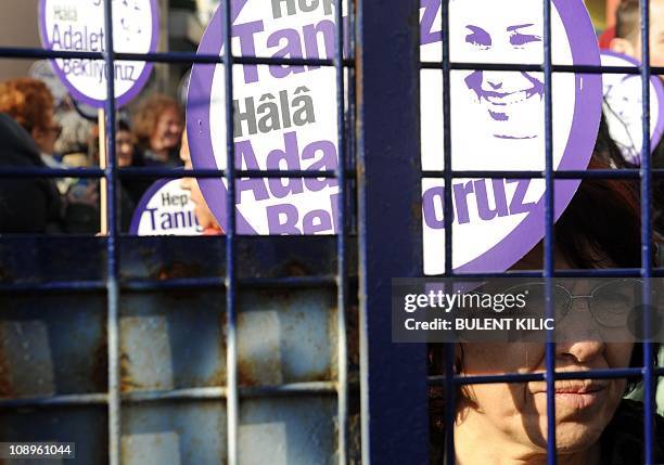 Turkish sociologist Pinar Selek's supporters hold signs, reading: ''We are all witnesses. We are sill waiting for justice,'' during a demonstration...