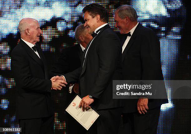 Sir Murray Halberg congratulates Michael Jones after being inducted into the New Zealand Sports Hall of Fame during the Westpac Halberg Awards at the...