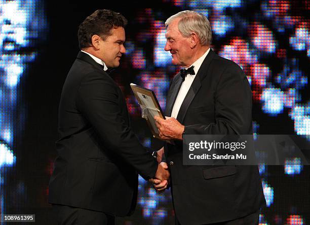 Michael Jones is congratulated by Sir Brian Lahore after being inducted into the New Zealand Sports Hall of Fame during the Westpac Halberg Awards at...