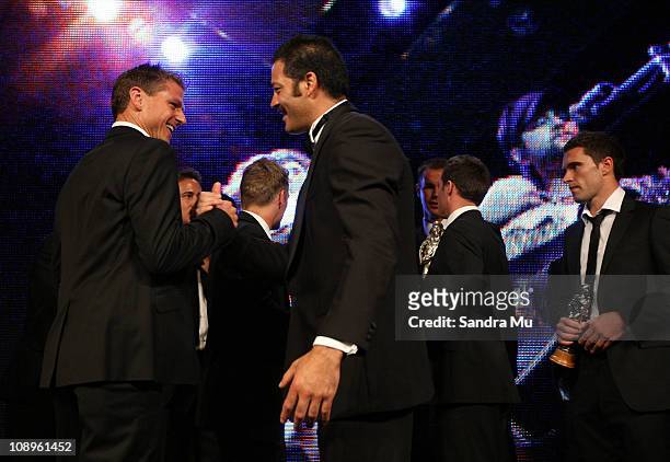 Corporal Willie Apiata VC congratulates Ben Sigmund of the All Whites after winning the Supreme award during the Westpac Halberg Awards at the...