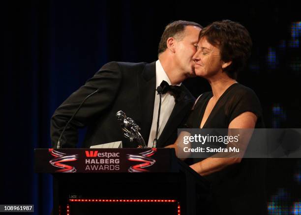 New Zealand Prime Minister John Key kisses Dame Susan Devoy before they present New Zealand's Favourite Sporting Moment award during the Westpac...