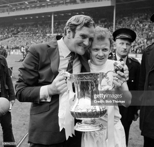 Leeds United captain Billy Bremner and manager Don Revie celebrate with the trophy after the Leeds United v Arsenal FA Cup Final held at Wembley...