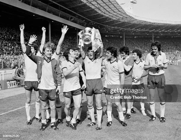 Sammy Nelson of Arsenal holds the trophy aloft while celebrating with team-mates after the Arsenal v Manchester United FA Cup Final held at Wembley...