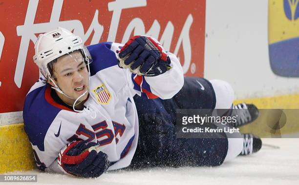 Ryan Poehling of the United States crashes into the boards during a quarter-final game versus the Czech Republic at the IIHF World Junior...