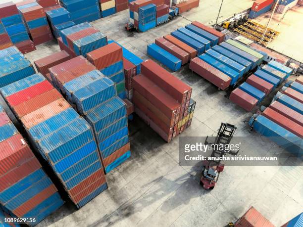 aerial top view crane truck drive lifting container in warehouse. - truck side view stock pictures, royalty-free photos & images