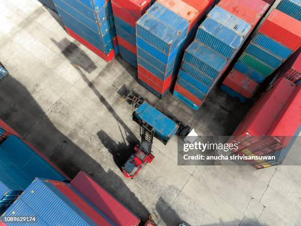 aerial top view crane truck drive lifting container in warehouse. - truck side view stock pictures, royalty-free photos & images