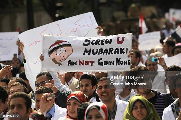 Doctors, medical workers and students march through Cairo to join anti-government protests in Tahrir Square on February 10, 2011 in Cairo, Egypt....
