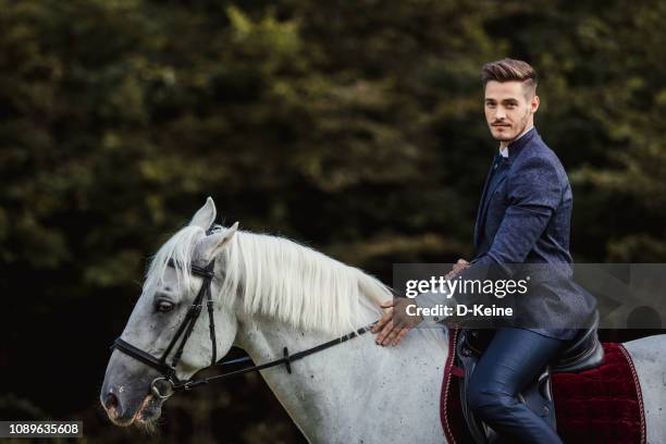 well dressed man - horse riders stock pictures, royalty-free photos & images