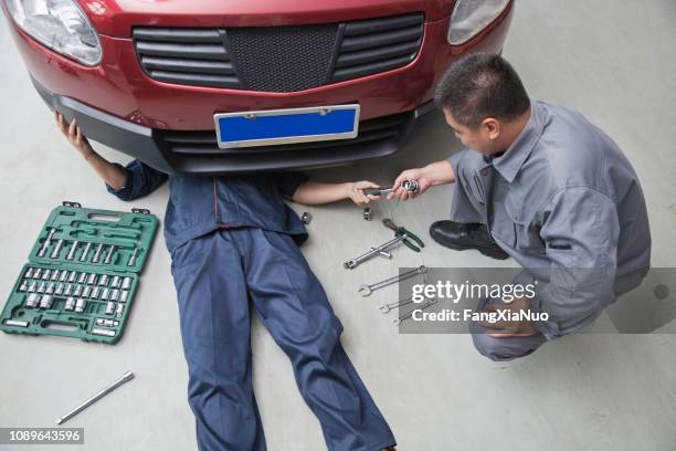 chinese mechanics working in garage - car toolbox stock pictures, royalty-free photos & images