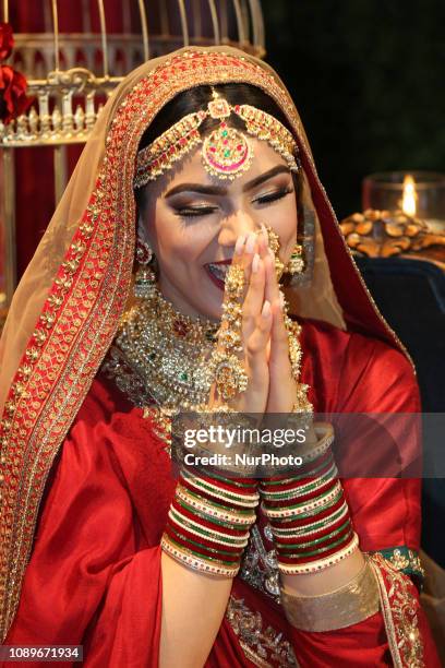 Indian model wearing an exquisite bridal lehenga with traditional opulent jewellery during the Lavish Dulhan bridal show in Toronto, Ontario, Canada....