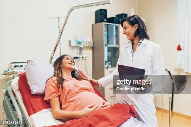 pregnant woman preparing for delivery - gynaecologist stock pictures, royalty-free photos & images