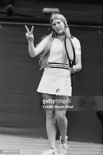 American tennis player Andrea Jaeger makes the peace sign while competing at Wimbledon, London, UK, 30th June 1980.