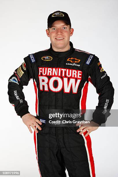 Regan Smith, driver of the Furniture Row Chevrolet, poses during the 2011 NASCAR Sprint Cup Series Media Day at Daytona International Speedway on...