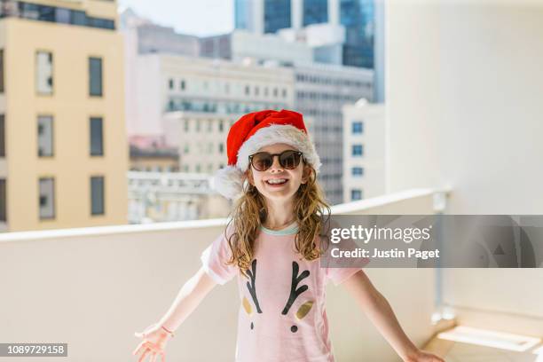 Excited young girl in santa hat