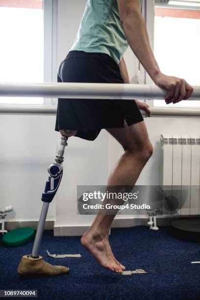 disabled man at physiotherapy center - amputee rehab stock pictures, royalty-free photos & images