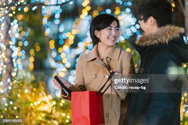 boyfriend surprising his girlfriend with gift - valentine japan stock pictures, royalty-free photos & images