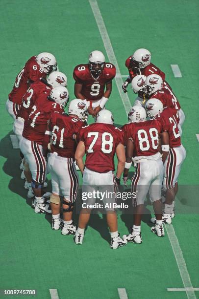 Pat Bonner, Quarterback for the Temple University Owls talks to his team in the huddle during the NCAA Big Ten Conference college football game...