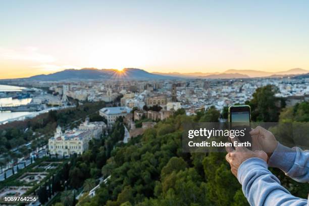 taking pictures to málaga city with a phone - alcazaba of málaga stock pictures, royalty-free photos & images