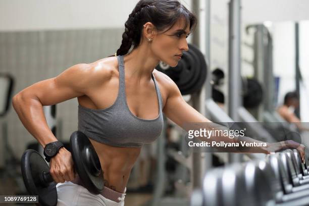 strong woman bodybuilder - female muscle builders stock pictures, royalty-free photos & images