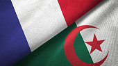 Algeria and France two flags together realations textile cloth fabric texture