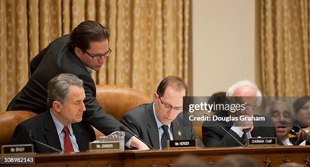 Wally Herger, R-CA., Chairman Dave Camp, R-MI., and Sander Levin, D-MI., during the House Ways and Means hearing on health care law and medicare in...