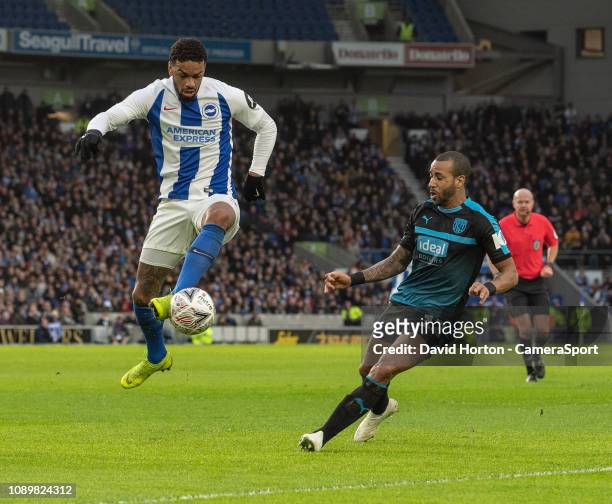West Bromwich Albion's Tyrone Mears battles with Brighton & Hove Albion's Jurgen Locadia during the FA Cup Fourth Round match between Brighton & Hove...