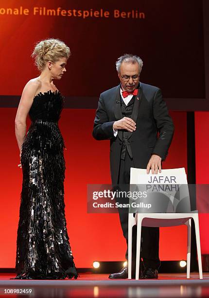 Presenter Anke Engelke and festival director Dieter Kosslick talk about Jafar Panahi at the grand opening ceremony during the opening day of the 61st...