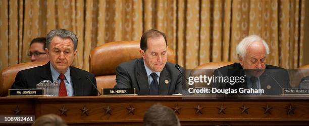 Wally Herger, R-CA., Chairman Dave Camp, R-MI., and Sander Levin, D-MI., during the House Ways and Means hearing on health care law and medicare in...