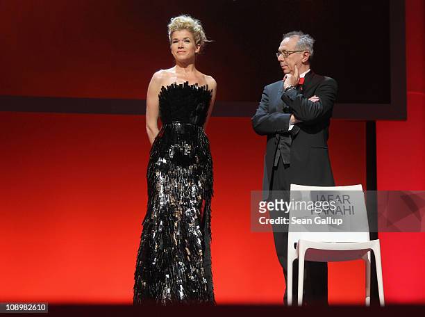 Presenter Anke Engelke and festival director Dieter Kosslick talk about Jafar Panahi at the grand opening ceremony during the opening day of the 61st...