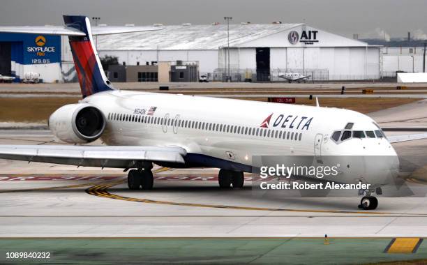 Delta Airlines McDonnell Douglas MD-90 passenger jet taxis after landing at San Antonio International Airport in Texas.