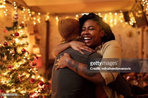 couple hugging - christmas choicepix stock pictures, royalty-free photos & images