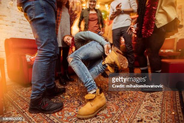 boy dancing with his friends at the party - dancing feet stock pictures, royalty-free photos & images