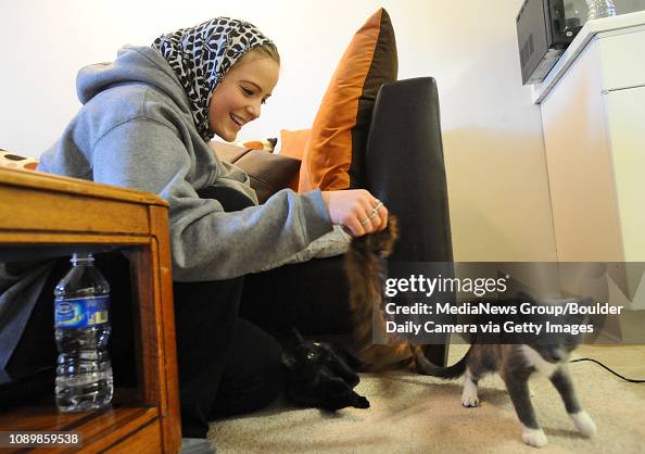 Maria Hardeman Maria Hardman plays with her friends' cats at their Boulder apartment ...