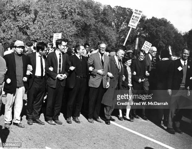View of demonstrators during the 'March on the Pentagon,' Washington DC, October 21, 1967. Among those pictured are, from left, Marcus Raskin, Noam...