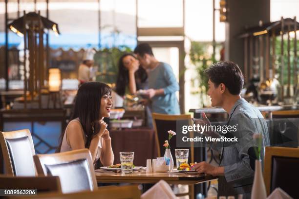 young couples in the restaurant - asian couple dining stockfoto's en -beelden